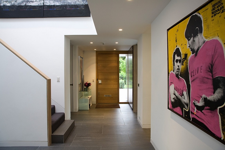 Entrance of the modern London home with interesting wall mural additions