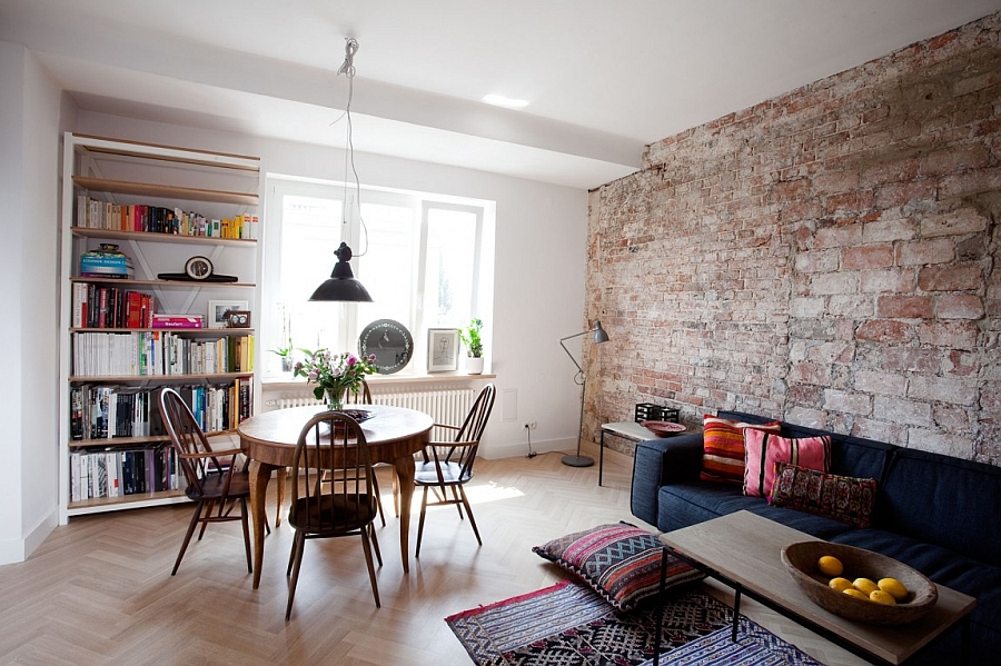 Exposed brick wall adds texture to the living room