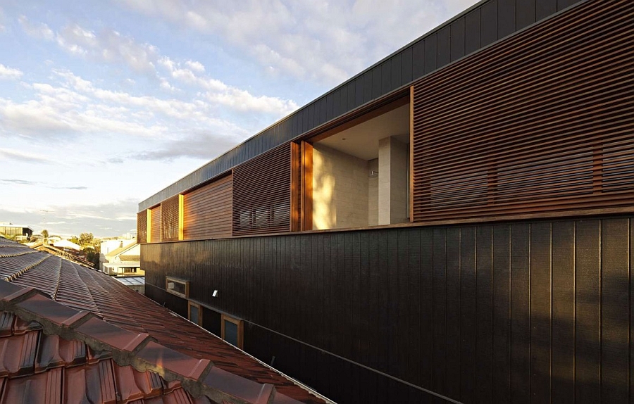 Exterior of the Plywood House combines ample ventilation with private quarters