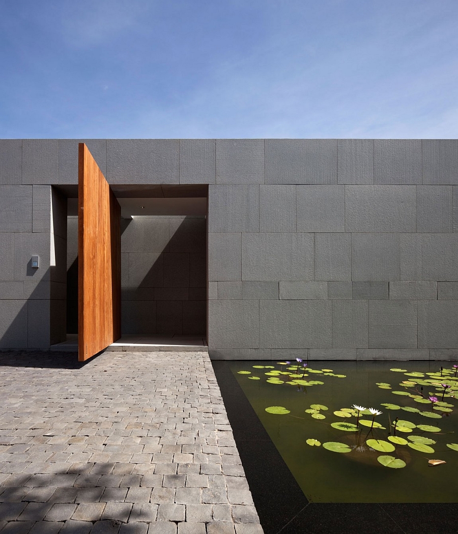 Fish pond on the interior of the house bordering a lovely walkway