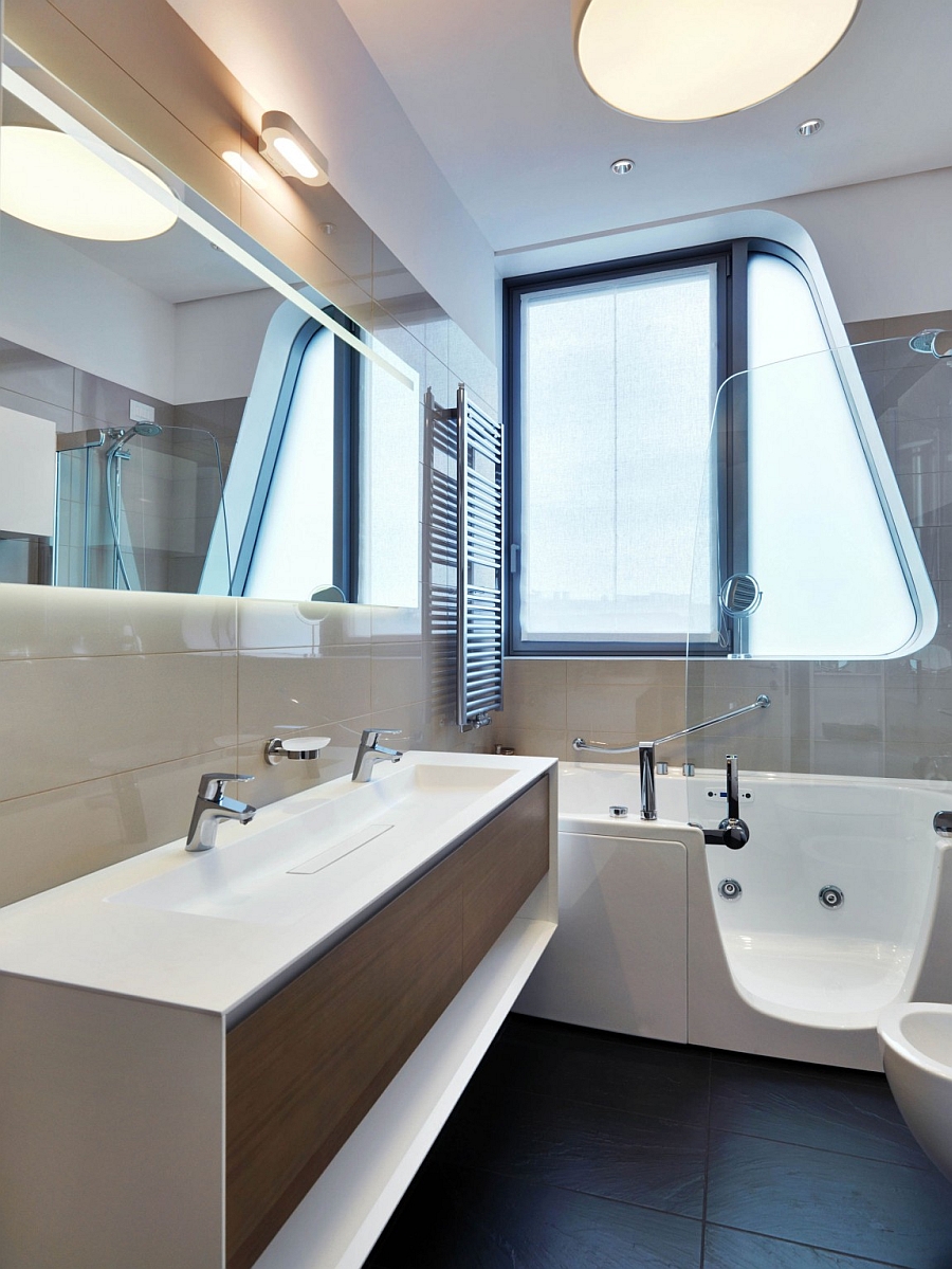 Floating vanity, bathtub and glass shower in the small bathroom