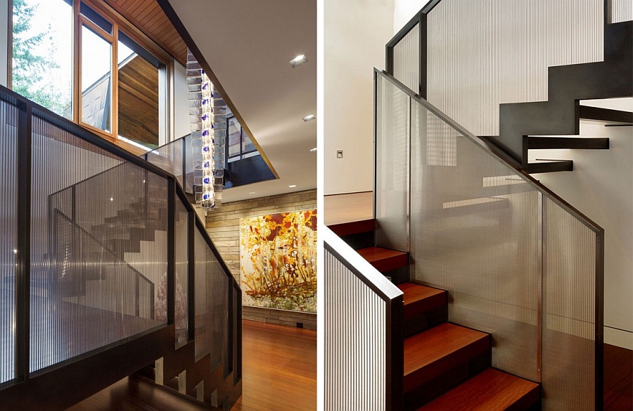 Glass staircase railing with steel frame brings contemporary style to the cozy retreat