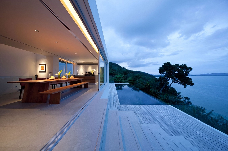 Gorgeous outdoor deck with infinity pool and transparent railing