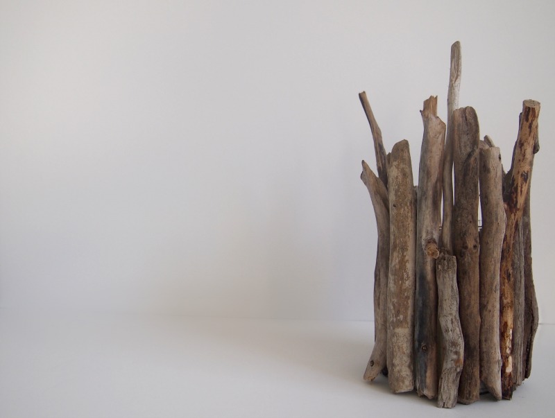 Improvize with the various sizes of driftwood to shape an inimitable candleholder