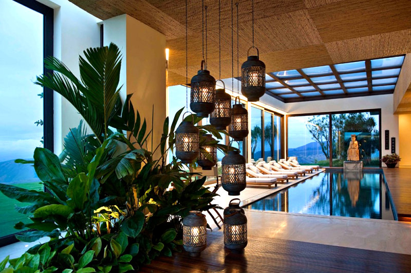 Indoor pool with lanterns and greenery