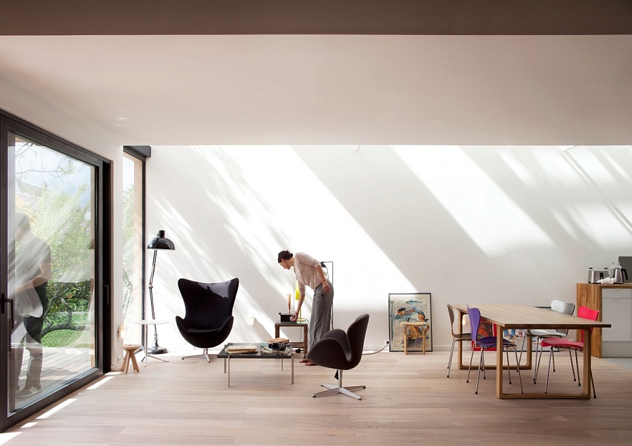 Large glass doors connect the interior with the deck outside