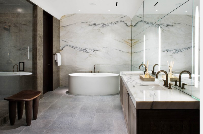 Modern bathroom with marble walls and countertop