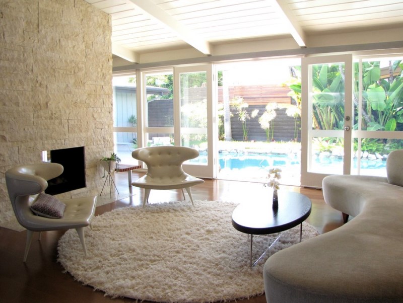 Modern living room with a pool view