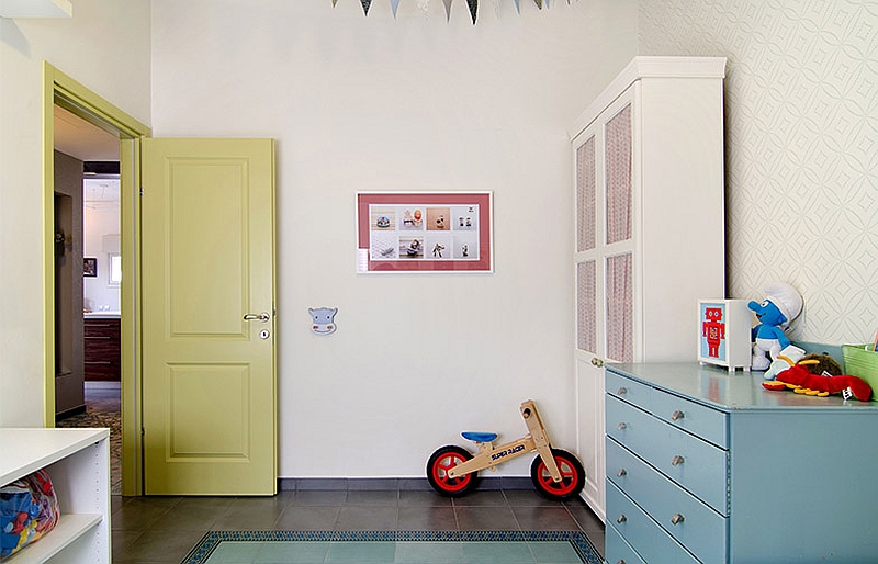 Painted doors and colorful cabinets bring life to the nursery