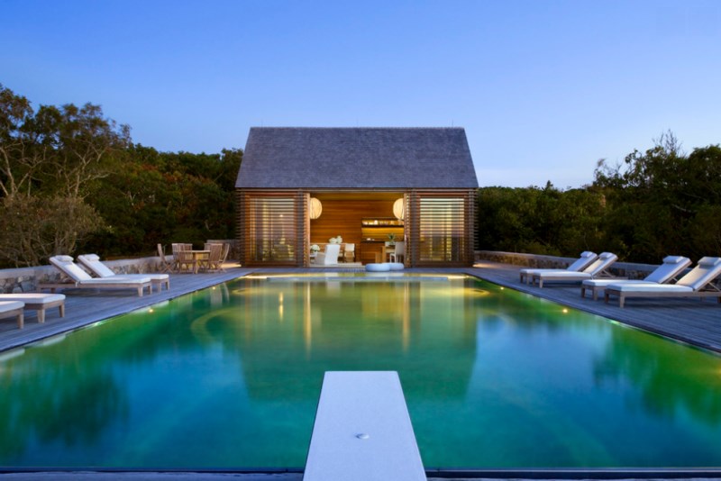 Pool house with a tranquil view