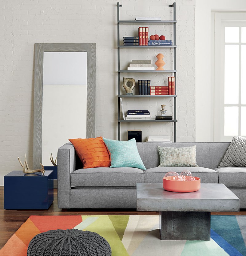 Shades of orange and peach in a gray living room