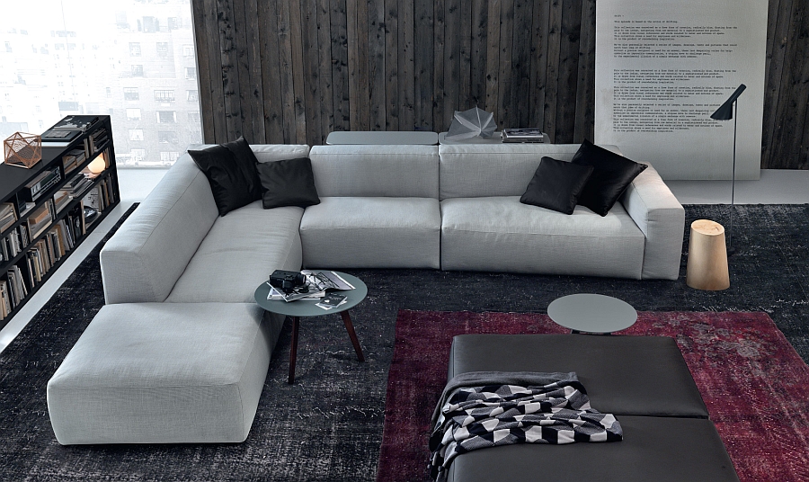 Sleek and curvy coffee tables complement the low-slung appeal of the couch