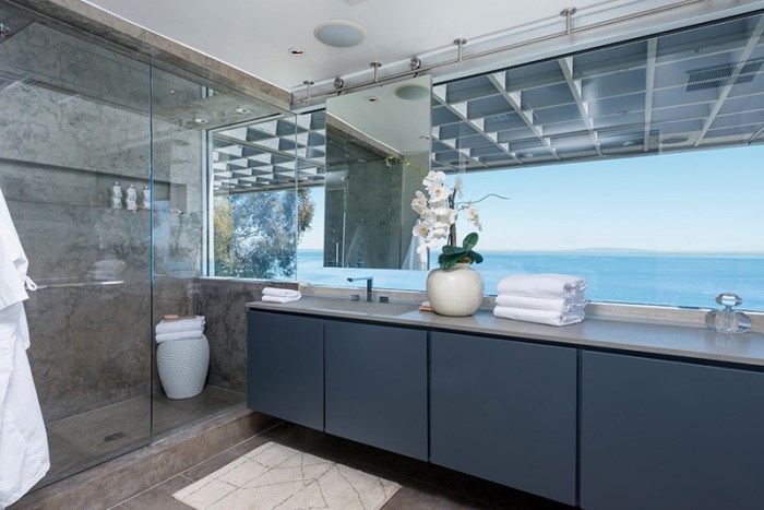 Sleek bathroom with an ocean view