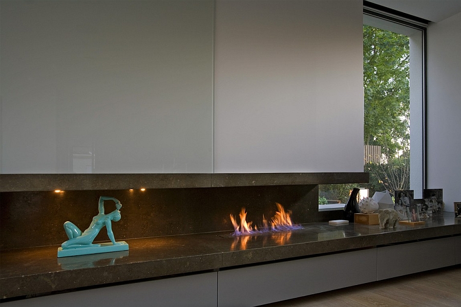 Sleek contemporary fireplace and curated decor in the London home