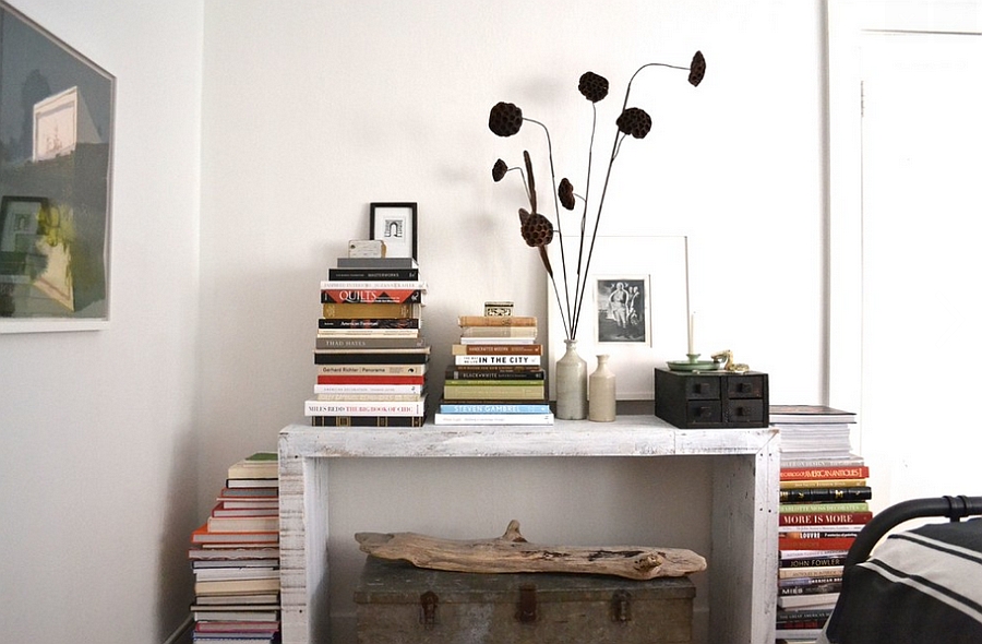 Stacking the books in style also saves up space! [Design: Brian Paquette Interiors]