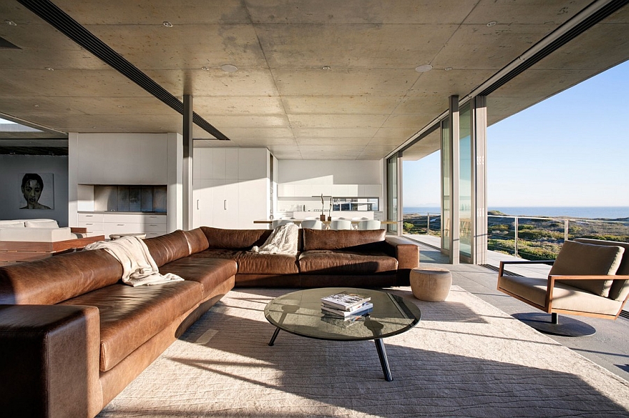 Stainless steel beams and exposed concrete add to the textural contrast of the house