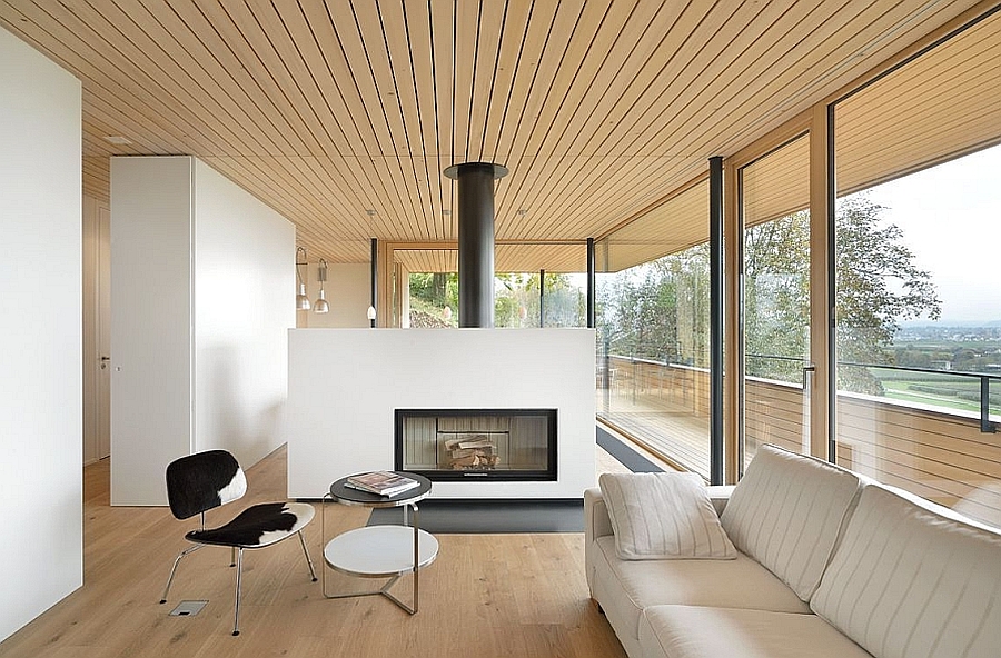 Stove in the living room acts as a divider between the living space and the dining