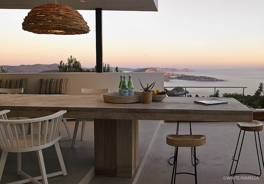 Stunning deck space and outdoor dining area with with a view of the distant sea