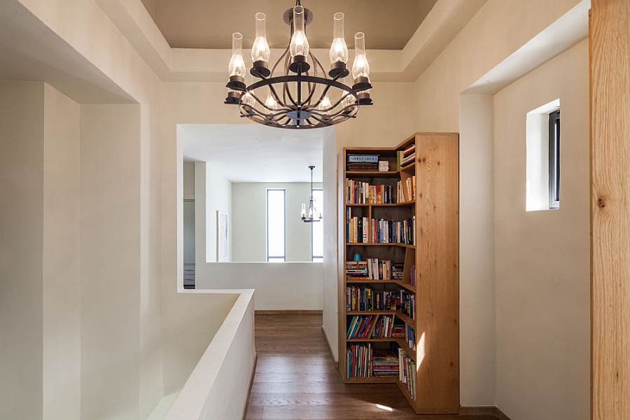 Trendy corner shelf makes appropriate use of the hallway space