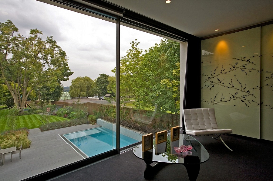 View of the pool area and the backyard from the bedroom