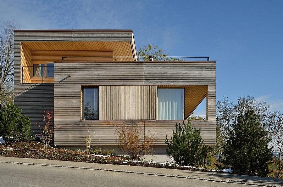 Wooden slats and drapes combine to offer ample privacy