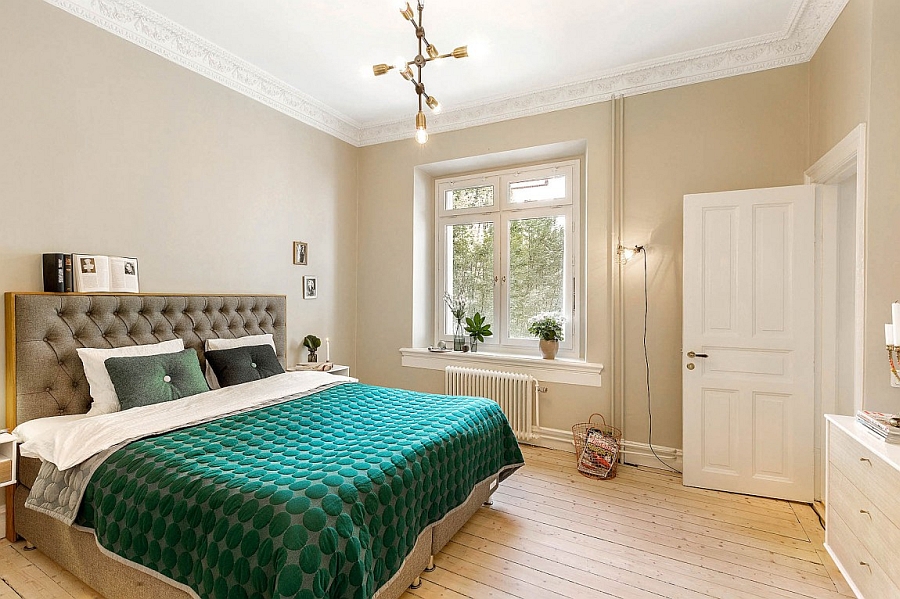 A splash of green adds color to the serene bedroom