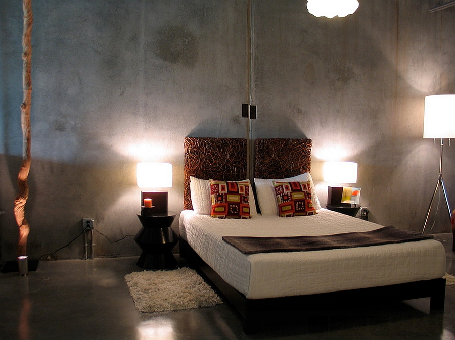 Basic concrete walls and floor look amazing in this industrial bedroom [By Pangaea Interior Design]