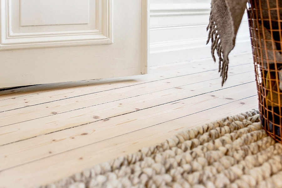 Beautiful wooden floor and carpet bring textural contrast to the space