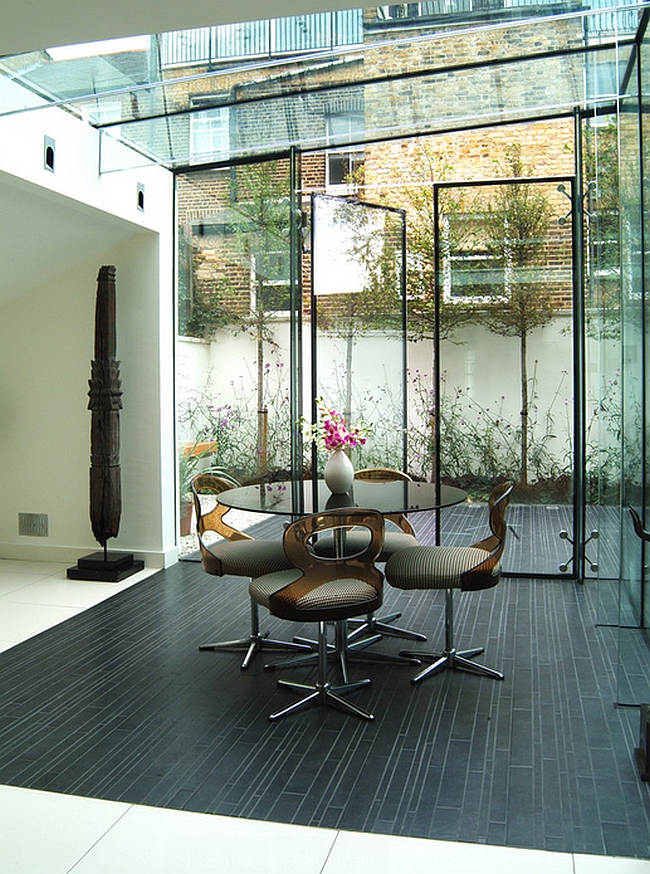 Black porcelain tile demarcates the lovely dining space