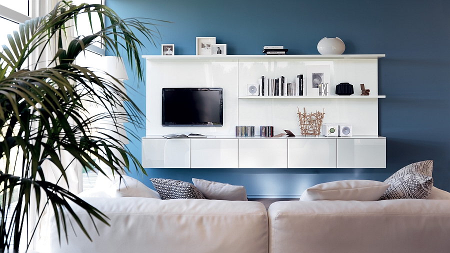 Blue accent wall adds to the allure of the wall unit and the TV Space