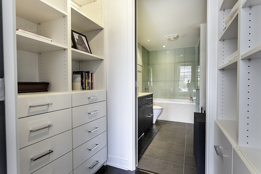 Built-in customized closets & organizers next to the bath