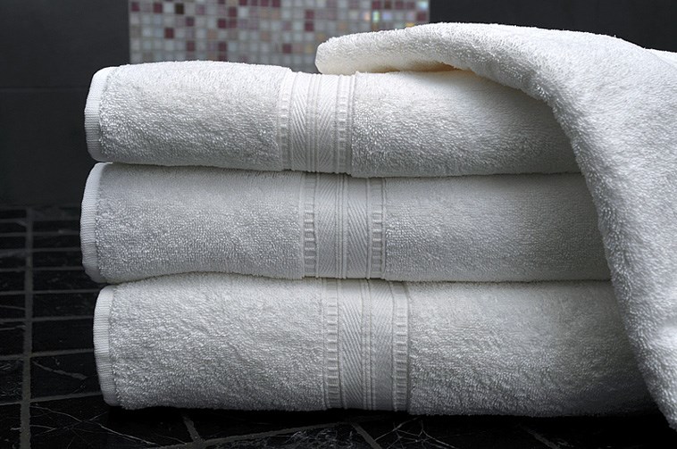 Clean white towels in a modern bathroom