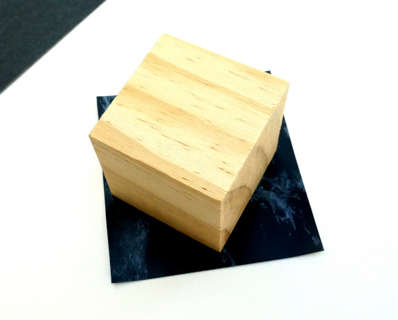 Contact paper and a wooden cube