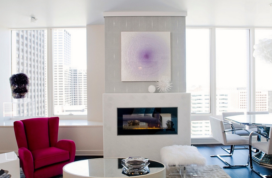 Contemporary living room with pink chair and sheepskin stool [Design: Eche Martinez]