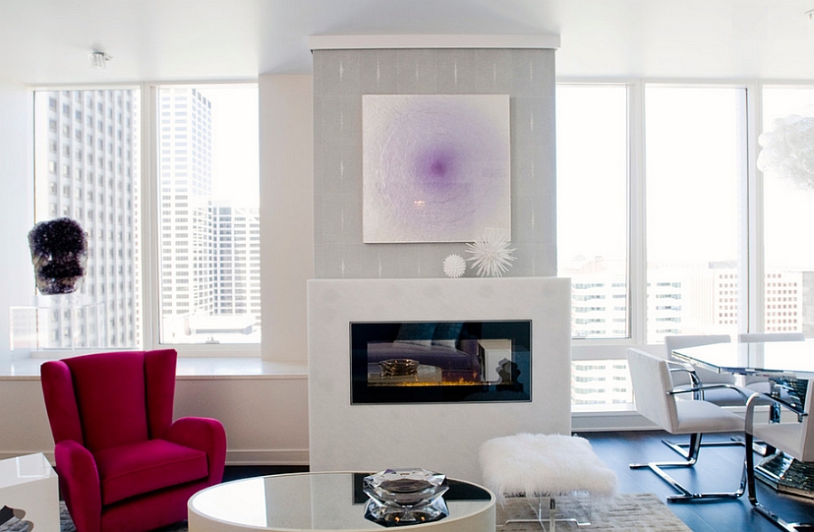 Contemporary living room with pink chair and sheepskin stool