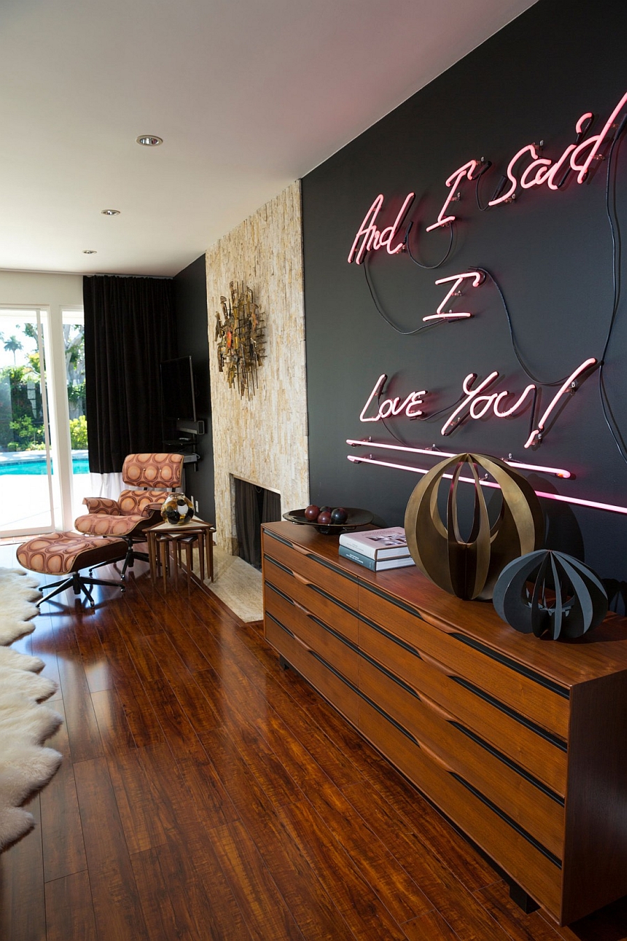 Decorated side table and the Eames Lounger in chic fabric add style to the space