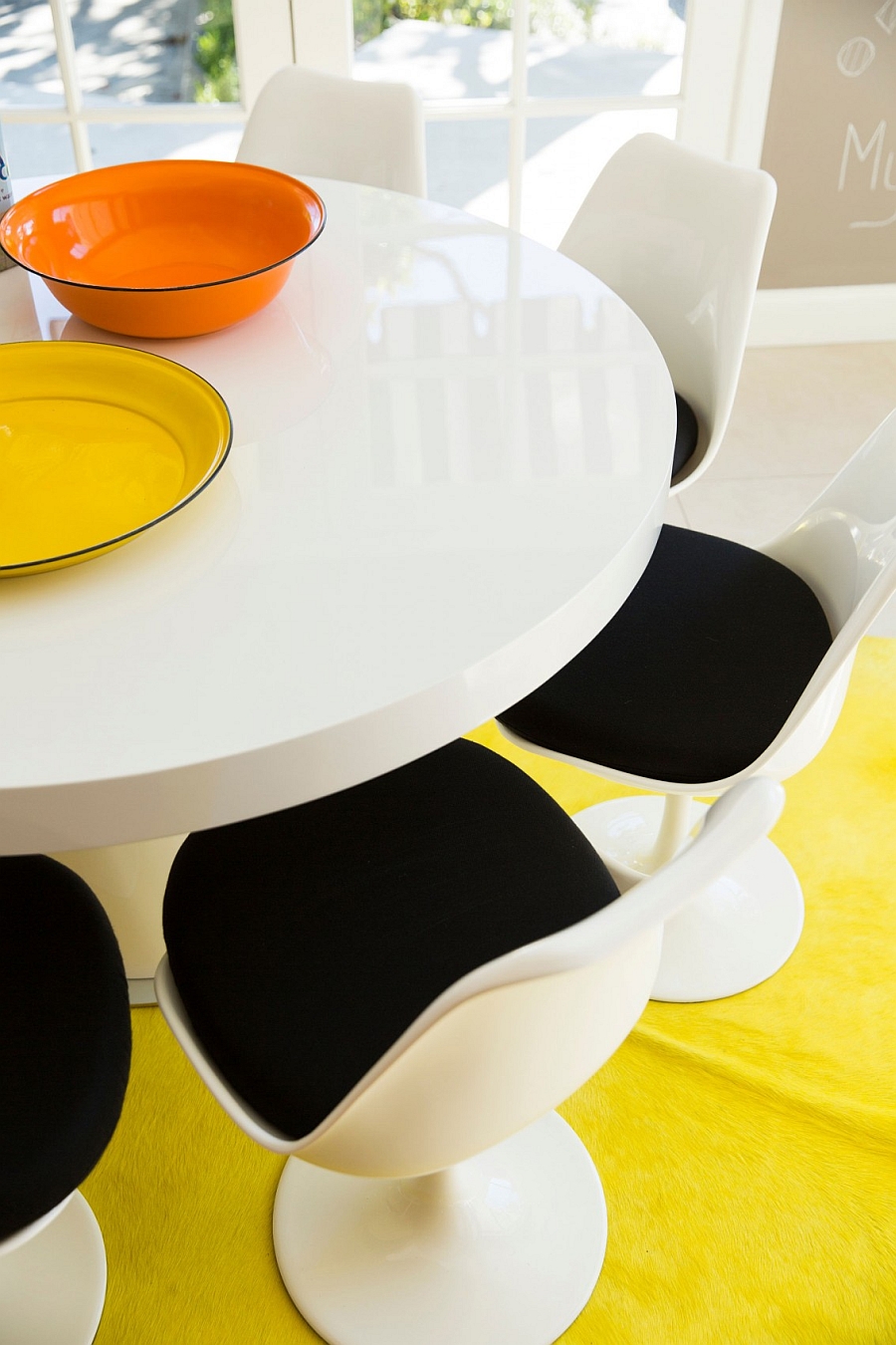 Dining table and chairs inspired by the iconic Tulip Design