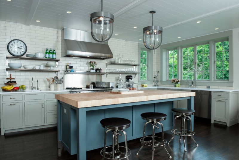 Dishes and glassware on stainless steel kitchen shelving