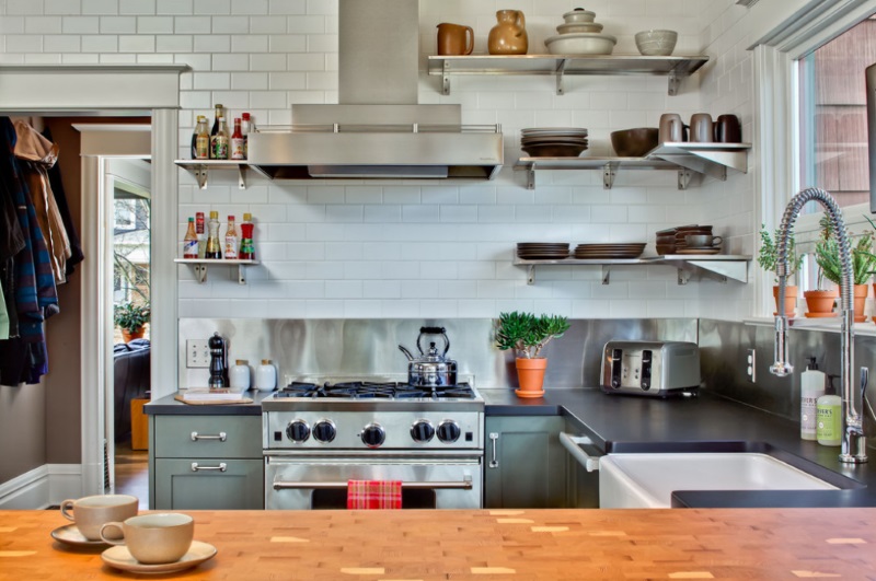 Eclectc kitchen with stainless steel corner shelving