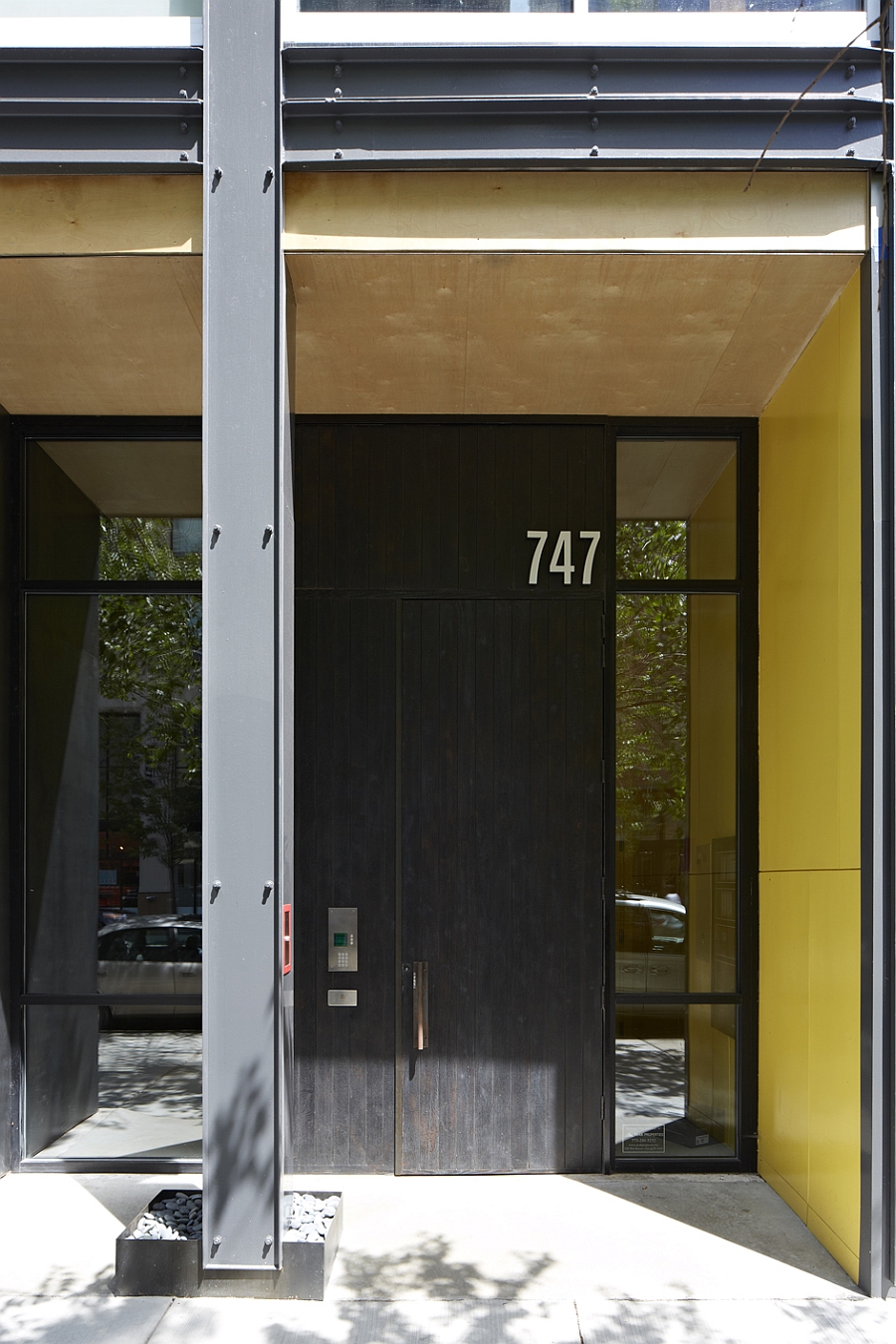 Entrance of 747 North Clark with a charred oak door