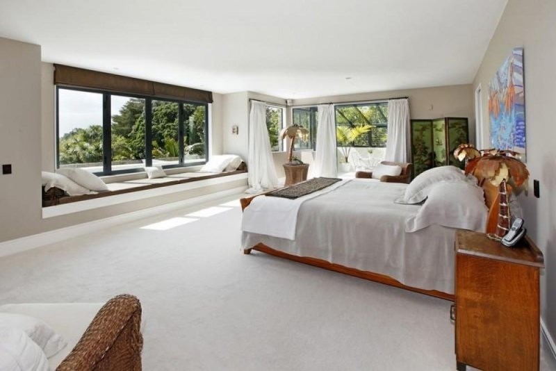 Expansive master bedroom with a window seat