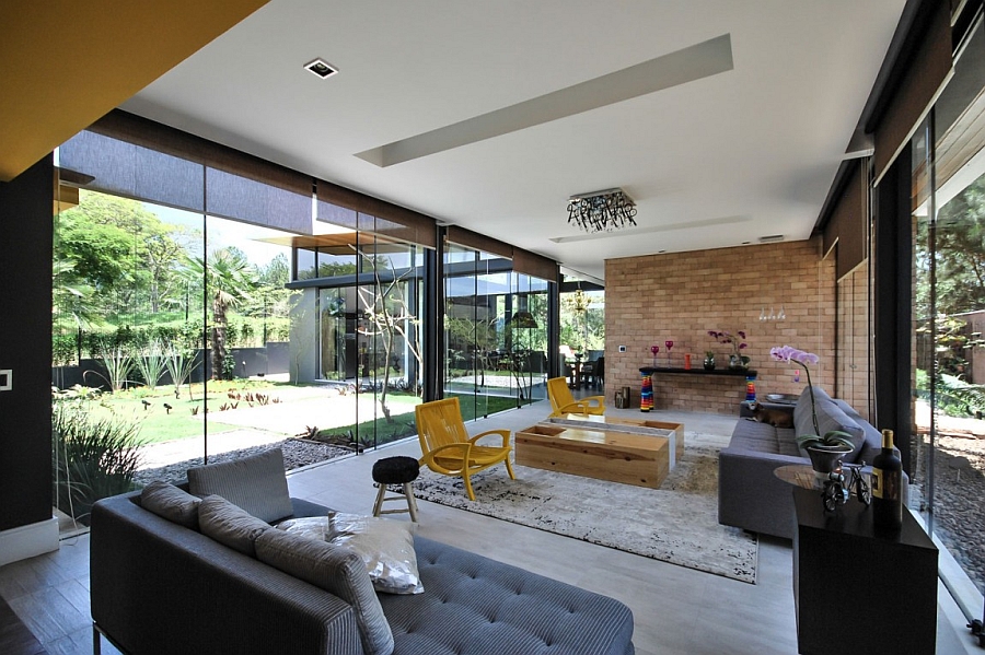 Large glass doors and walls blur the line between the indoors and the outdoors