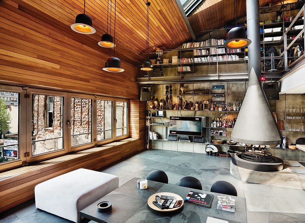Living room with industrial style, high ceiling and innovative storage system