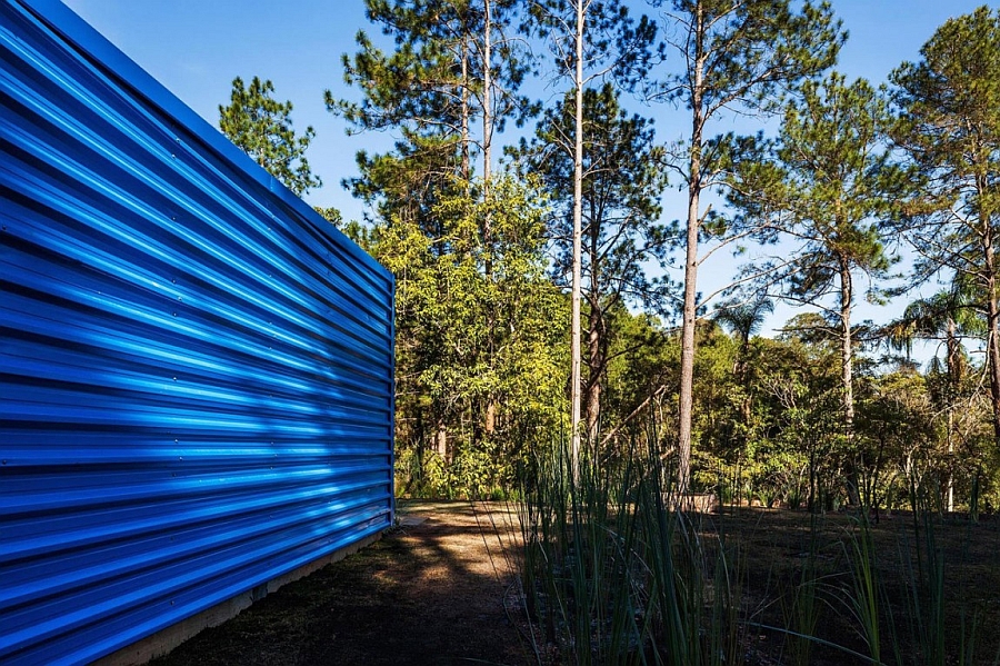 Metal exterior of the summer retreat gives it a distinct look