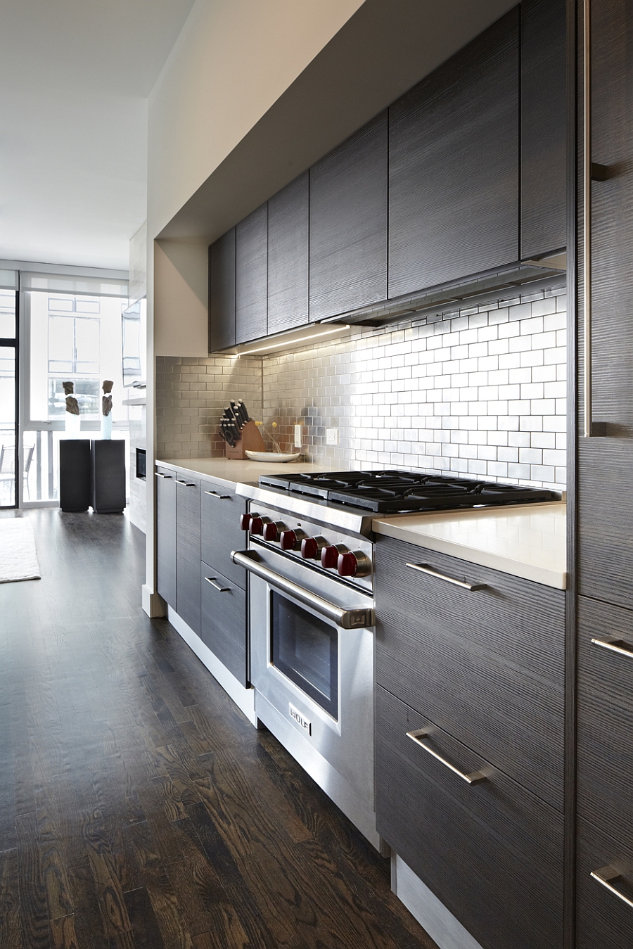 Modern, sleek kitchen of the Chicago home with tile backsplash