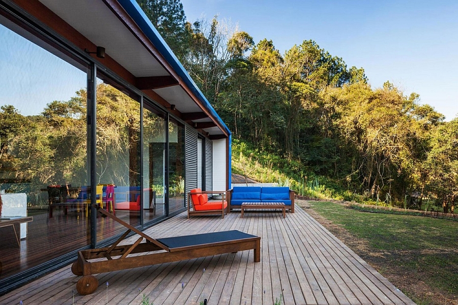 Outdoor deck area of the holiday home with a view of the surrounding landscape