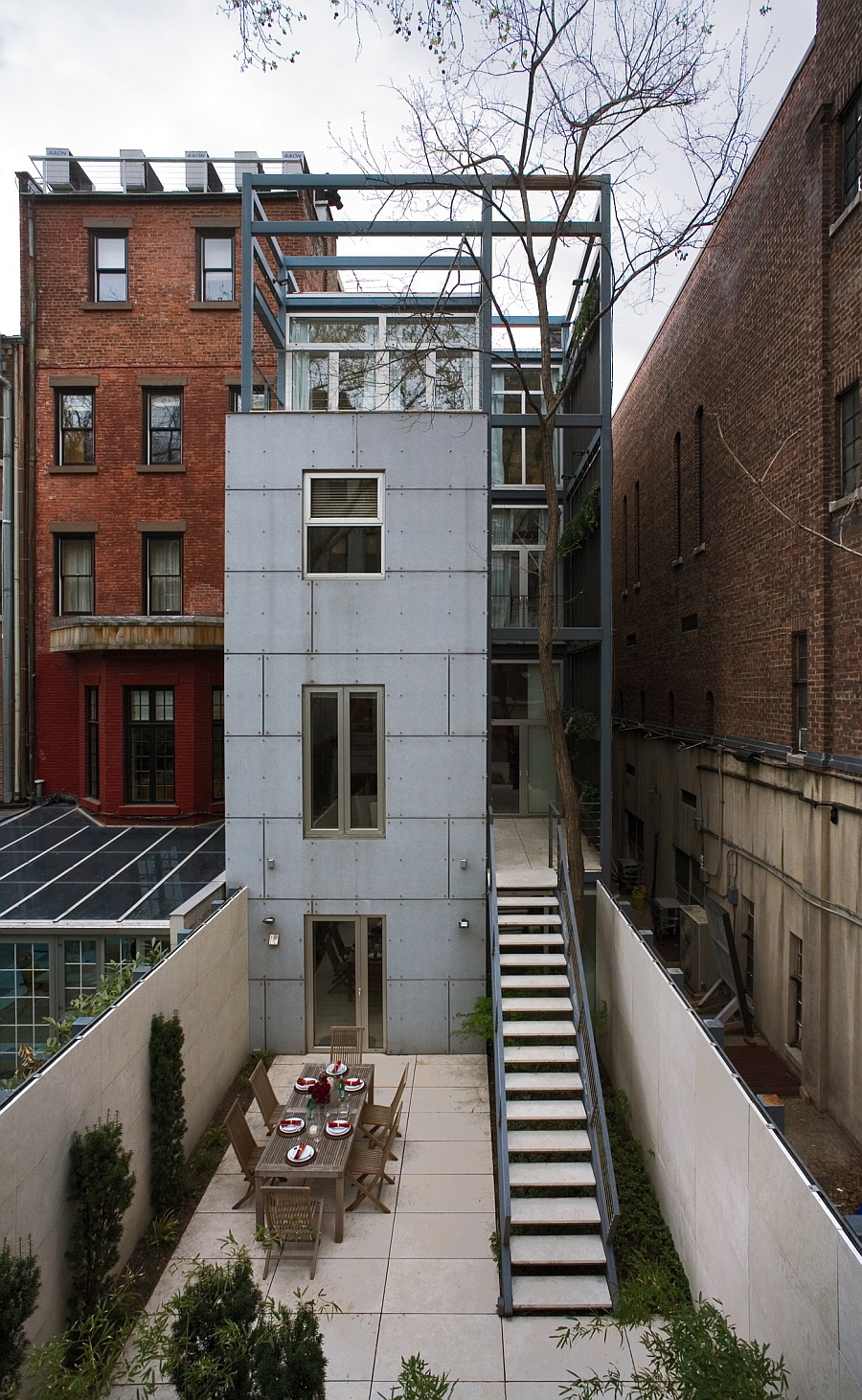 Outdoor stairs from the second floor to the backyard of the townhouse