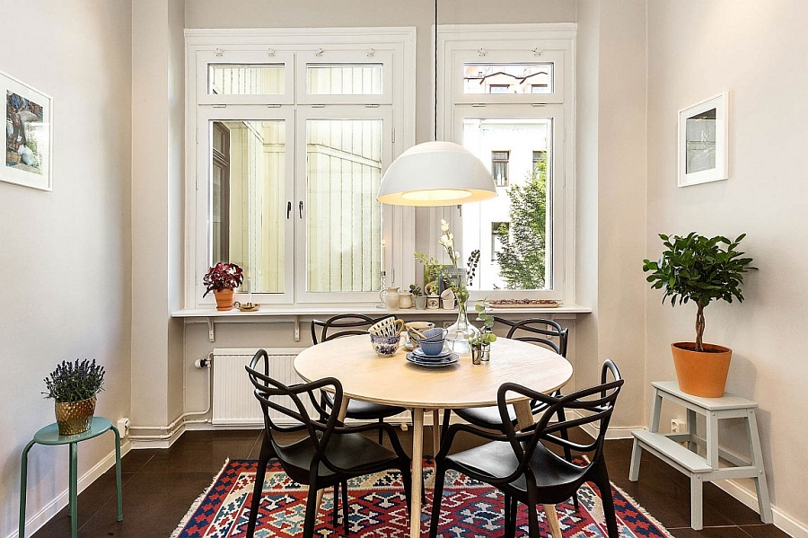 Philippe Strack's Masters Chairs in black at the small dining table