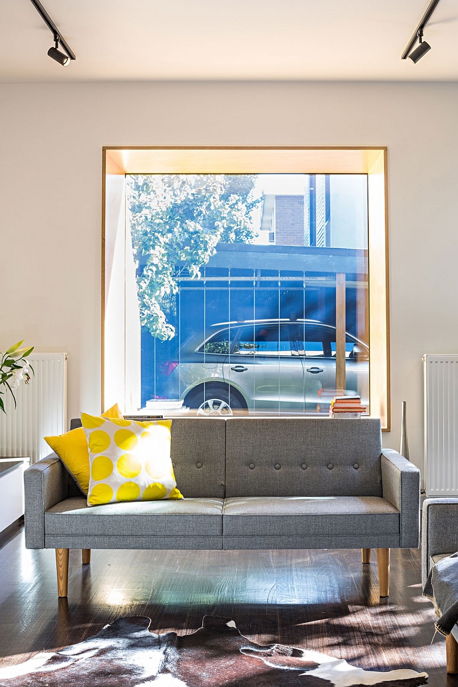 Plush couch in gray with midcentury charm