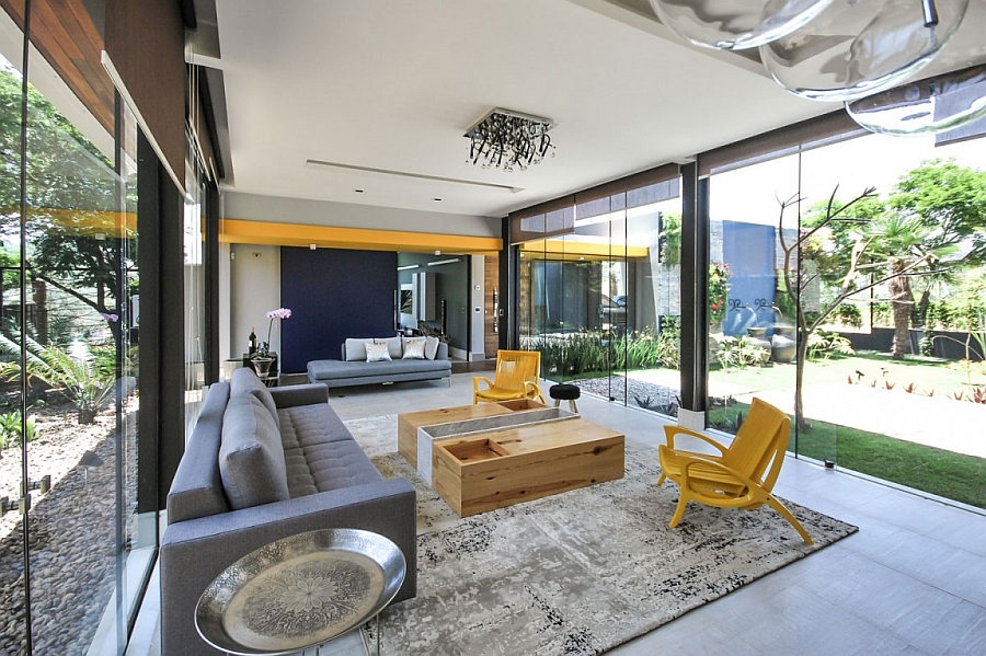 Pops of yellow and blue enliven the spacious living area